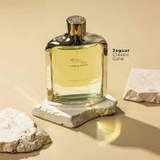 Jaguar cologne bottle on a stone surface with rocks in the background