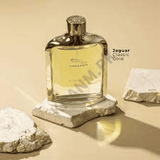 Jaguar cologne bottle on a stone surface with rocks in the background