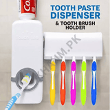 Toothpaste dispenser and toothbrush holder with colorful toothbrushes on a neutral background