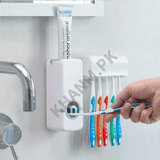 Wall-mounted toothbrush holder with colorful toothbrushes and a tube of toothpaste.