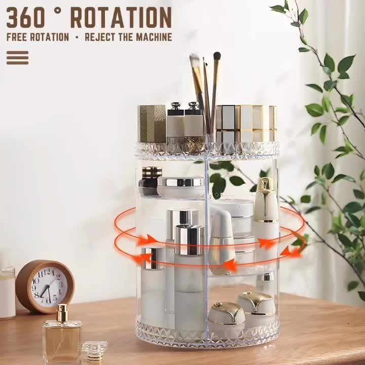 Rotating cylindrical organizer with cosmetic items on a wooden surface with a plant in the background.