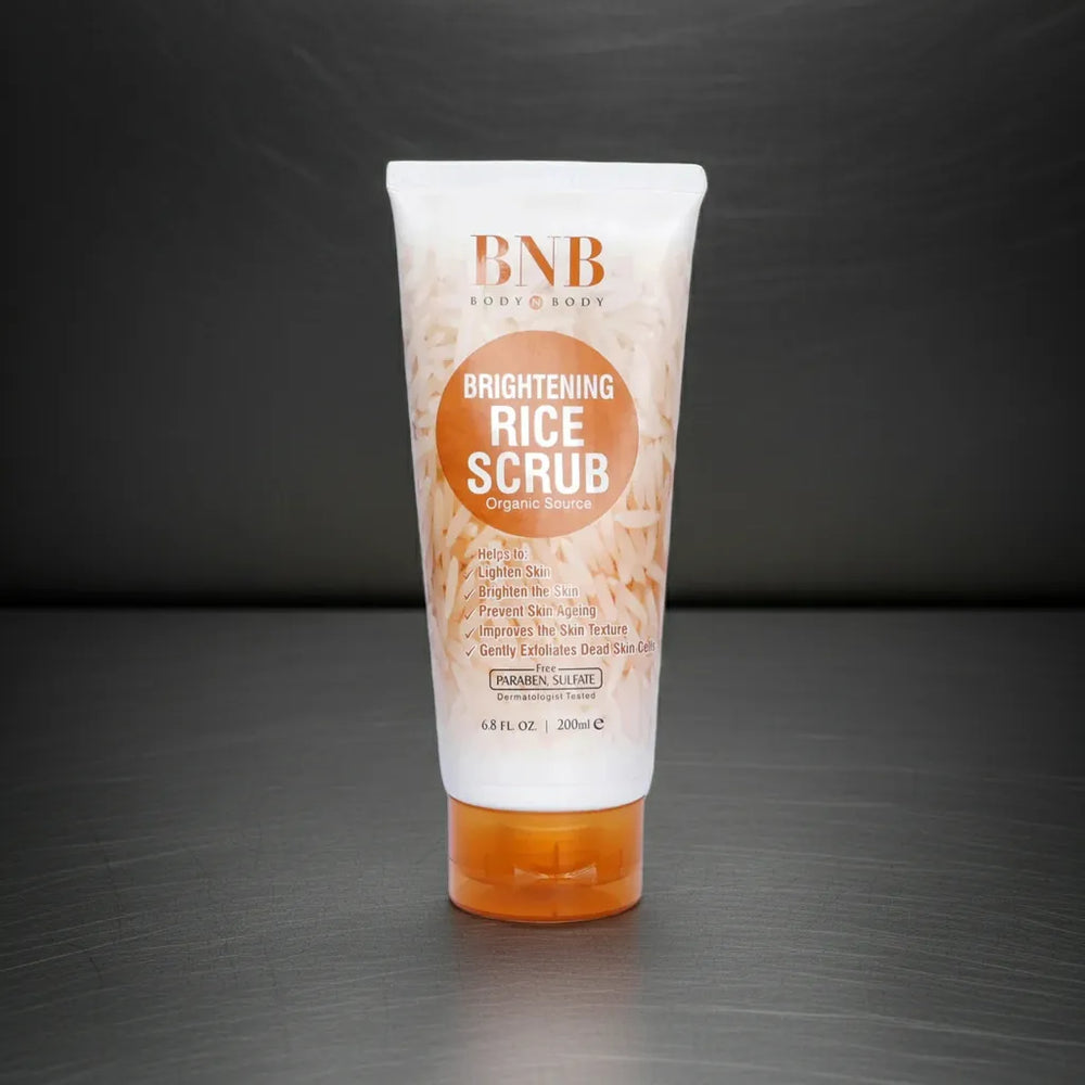 Tube of BNB Brightening Rice Scrub on a dark background